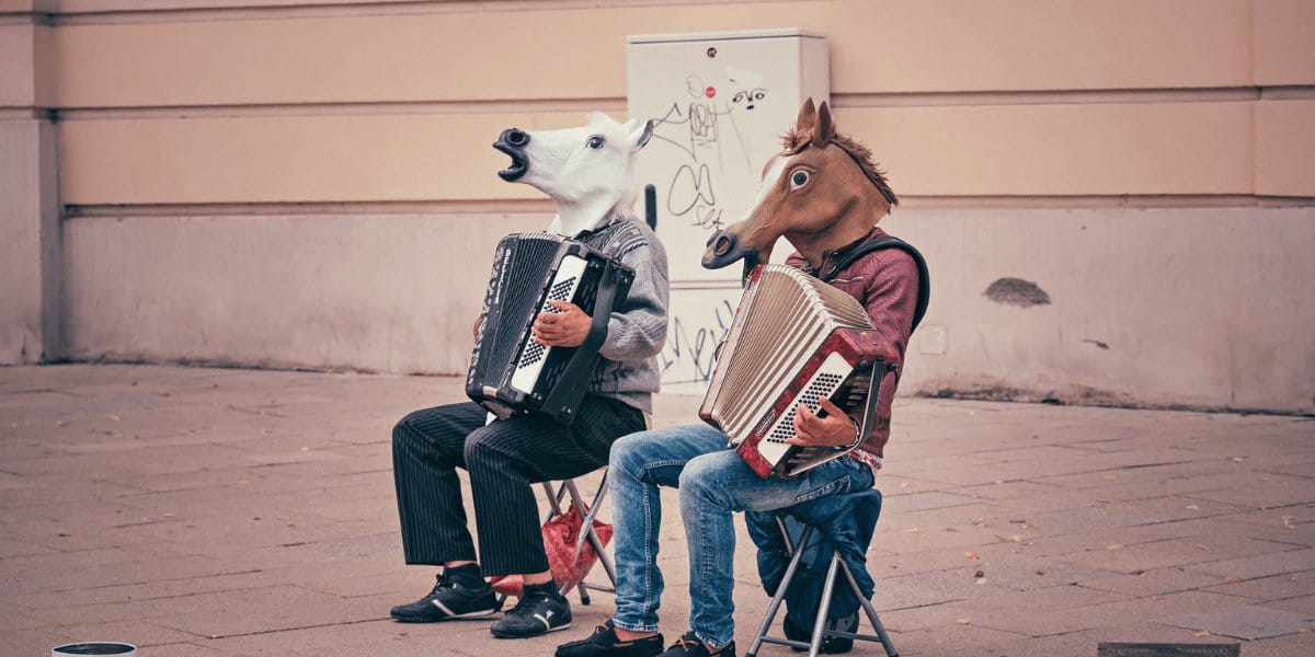 two person wearing horse heads